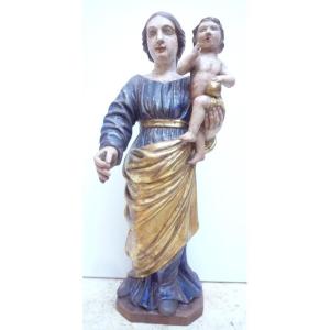 Vierge à l'enfant en bois sculpté, doré et polychromé.