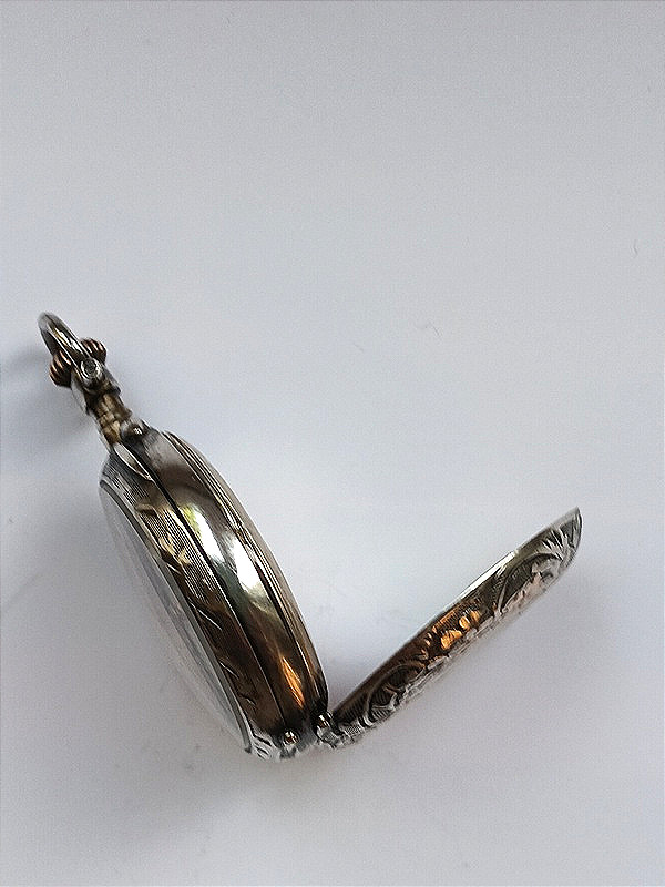 Montre à gousset pour femme en argent et vermeil à décor floral ciselé-photo-2