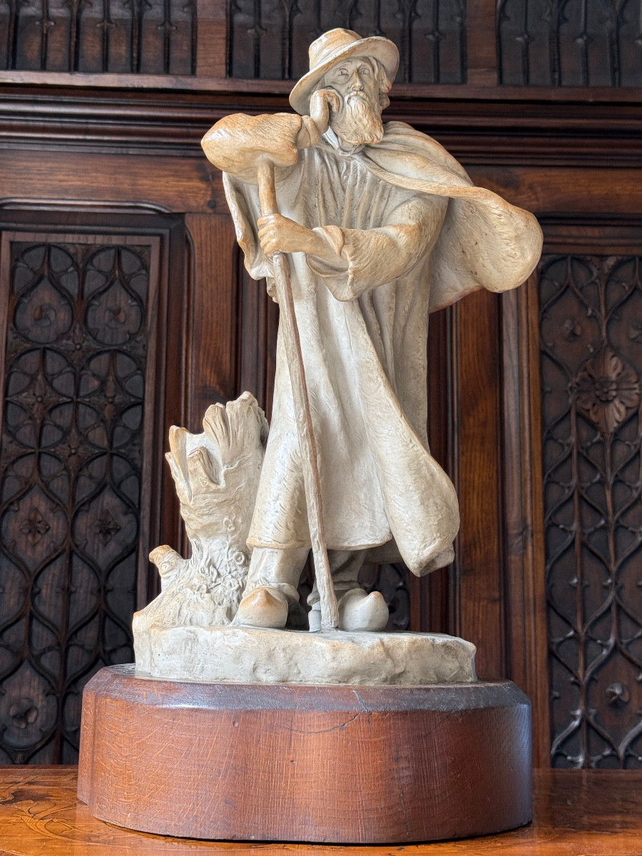 SEVRES Sculpture en gr&egrave;s d&#039;un berger sur socle en bois, Sign&eacute;e D. Vincent,  S&egrave;vres, Vers 1900