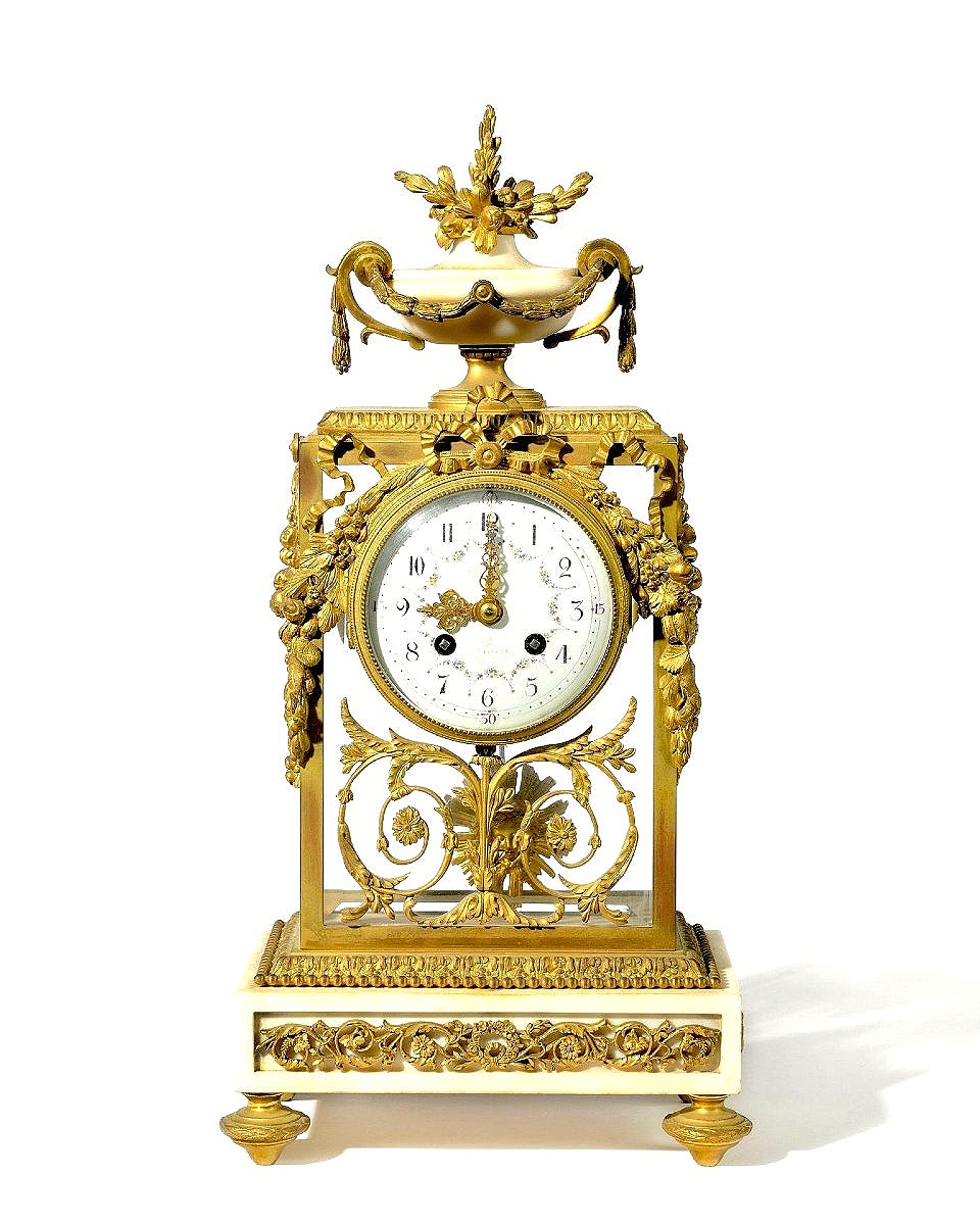 Pendule en marbre blanc et bronze doré 19ème siècle 