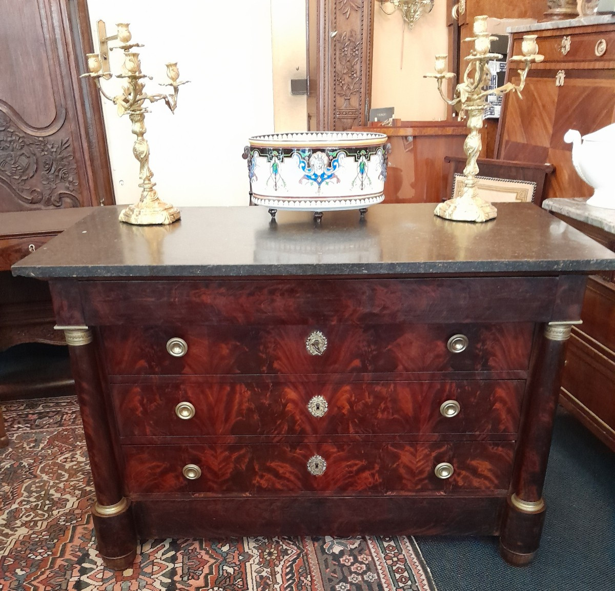 Empire Period Chest Of Drawers In Flamed Mahogany.