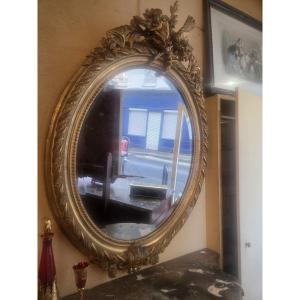 Miroir ovale en bois et stuc doré d'époque Napoléon III ( 120 x 85 cm)