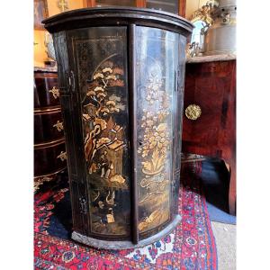 An 18th Century Chinese Lacquer Corner Cabinet.
