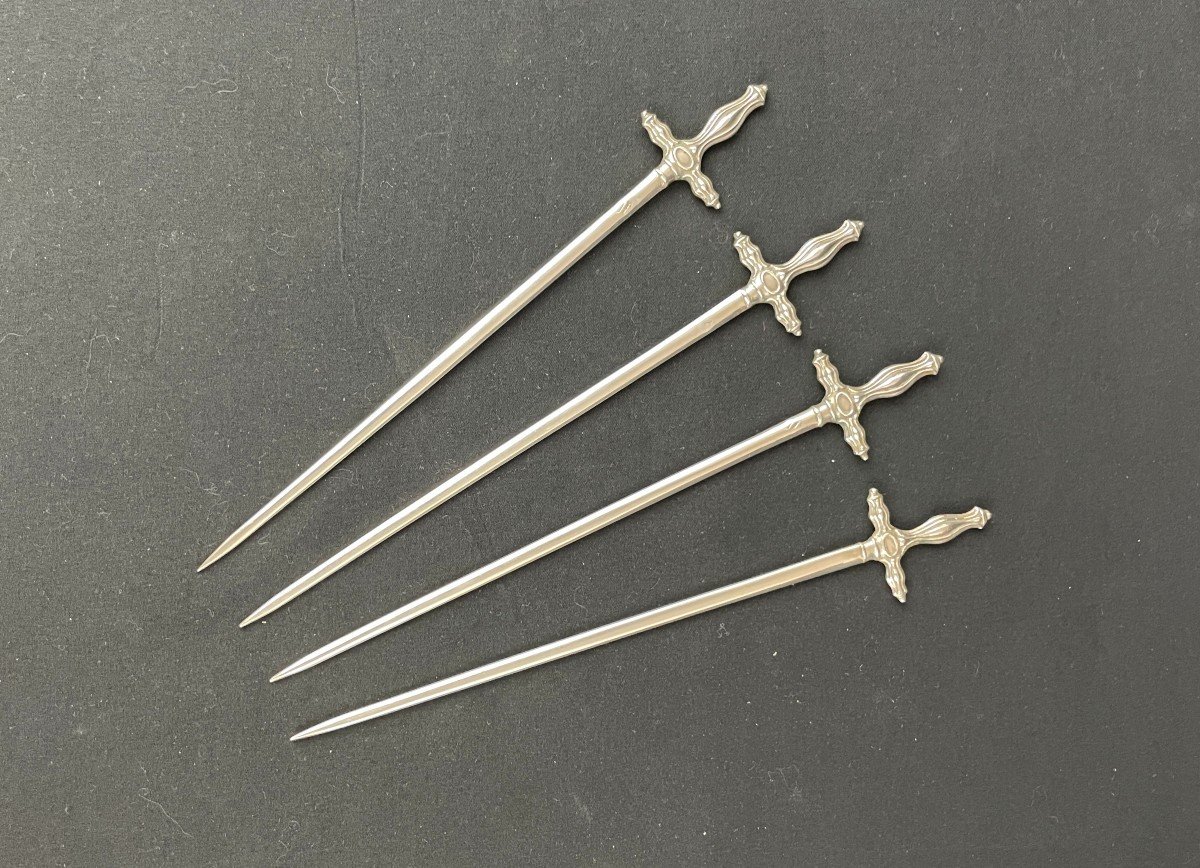 Four Hâtelet In The Shape Of A Silver Sword