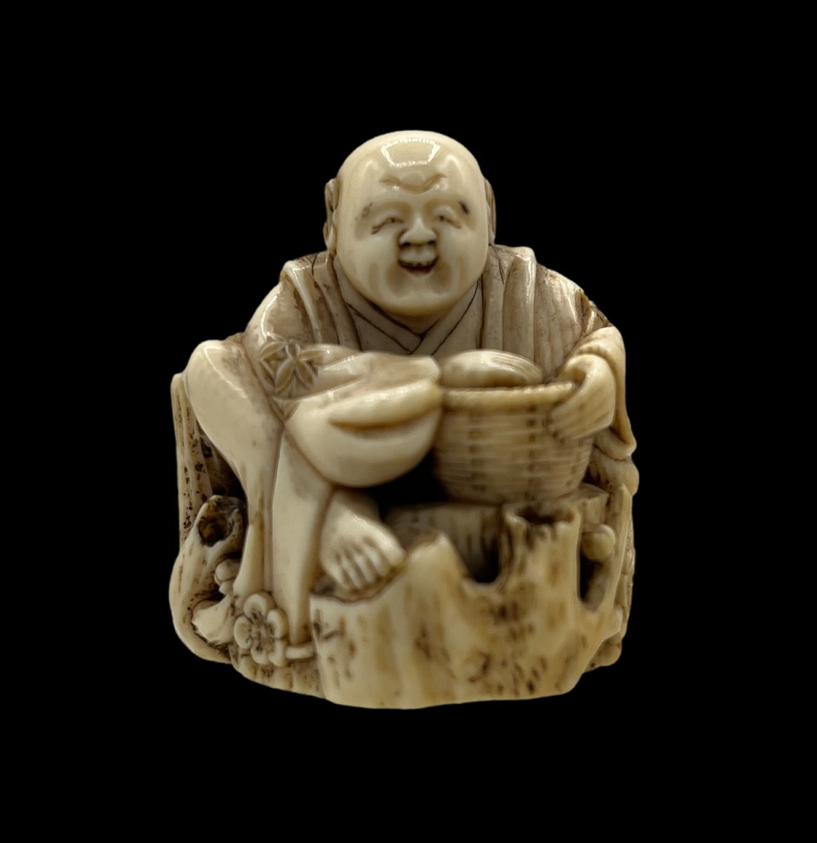 Netsuke man in a tree