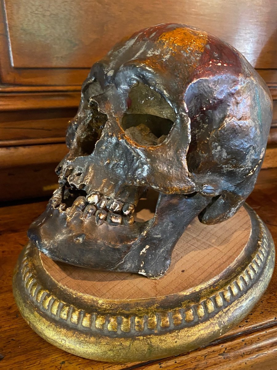 Realistic Skull In Tribal Painted Terracotta, On A Golden Wooden Base-photo-3
