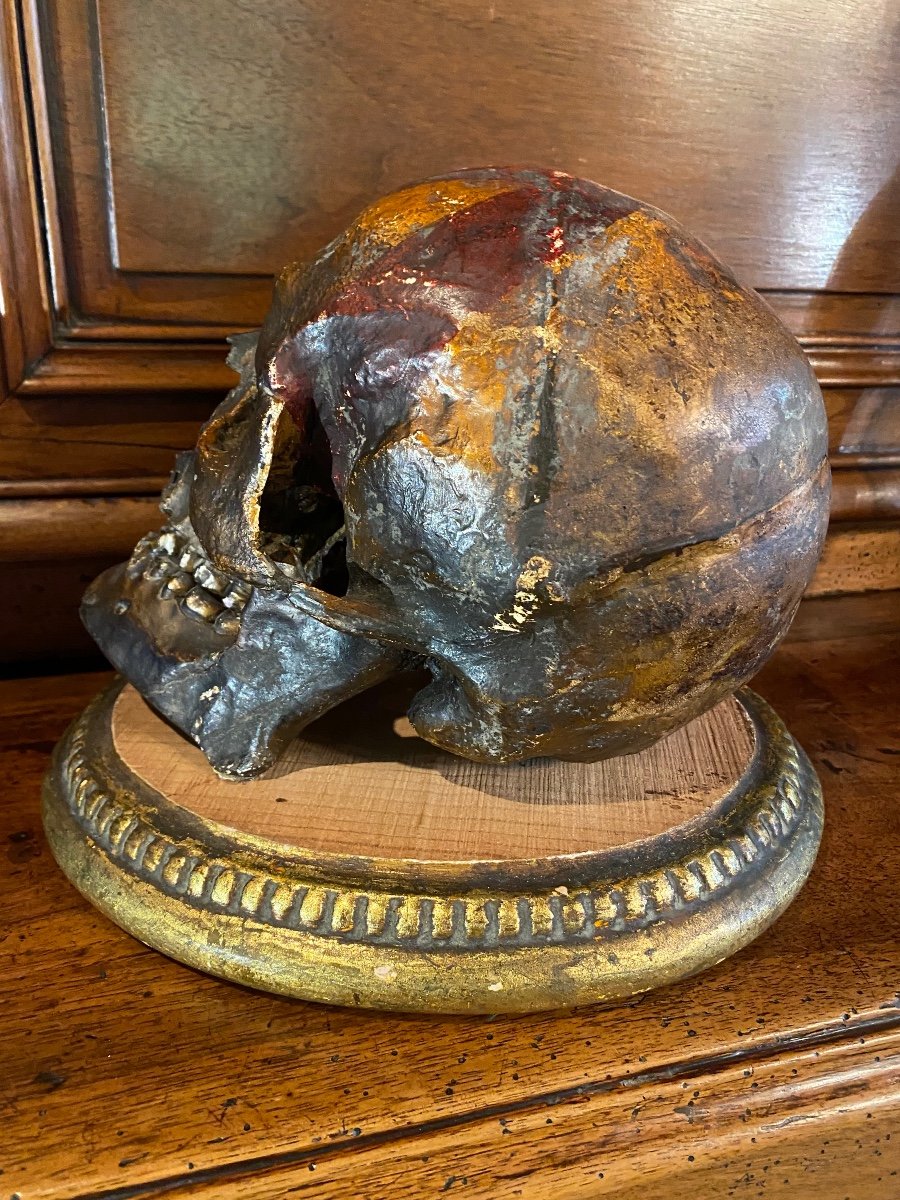 Realistic Skull In Tribal Painted Terracotta, On A Golden Wooden Base-photo-4