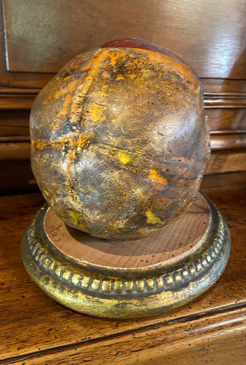 Realistic Skull In Tribal Painted Terracotta, On A Golden Wooden Base-photo-5