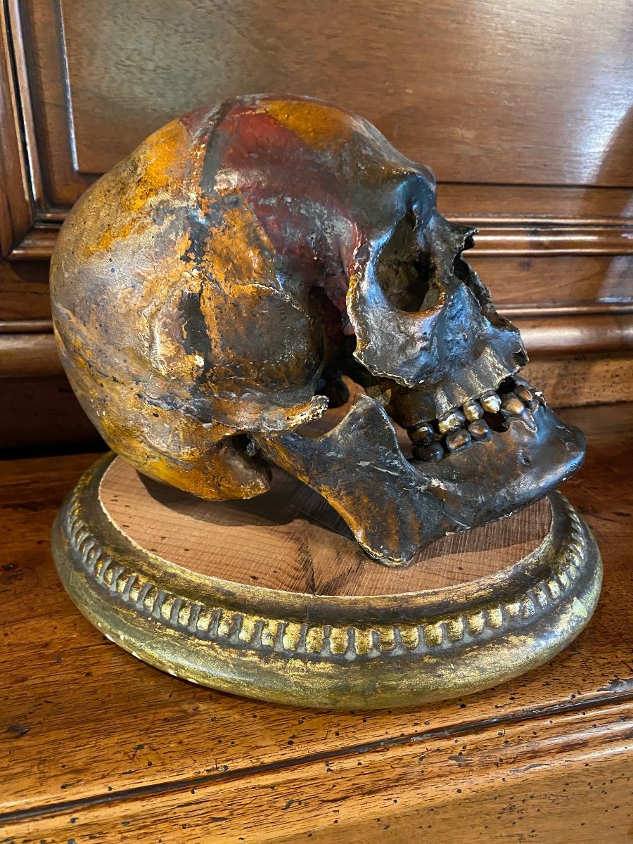 Realistic Skull In Tribal Painted Terracotta, On A Golden Wooden Base-photo-6