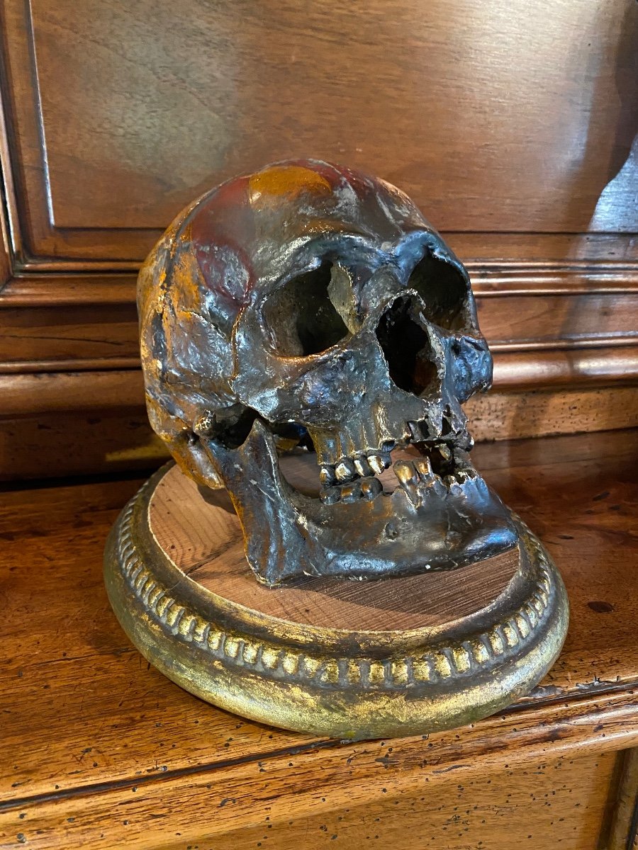Realistic Skull In Tribal Painted Terracotta, On A Golden Wooden Base-photo-8