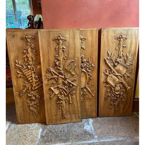 Four Panels Of Woodwork With Musical Instruments