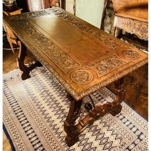 Grande table bureau sculptée en noyer de style renaissance formant bureau 