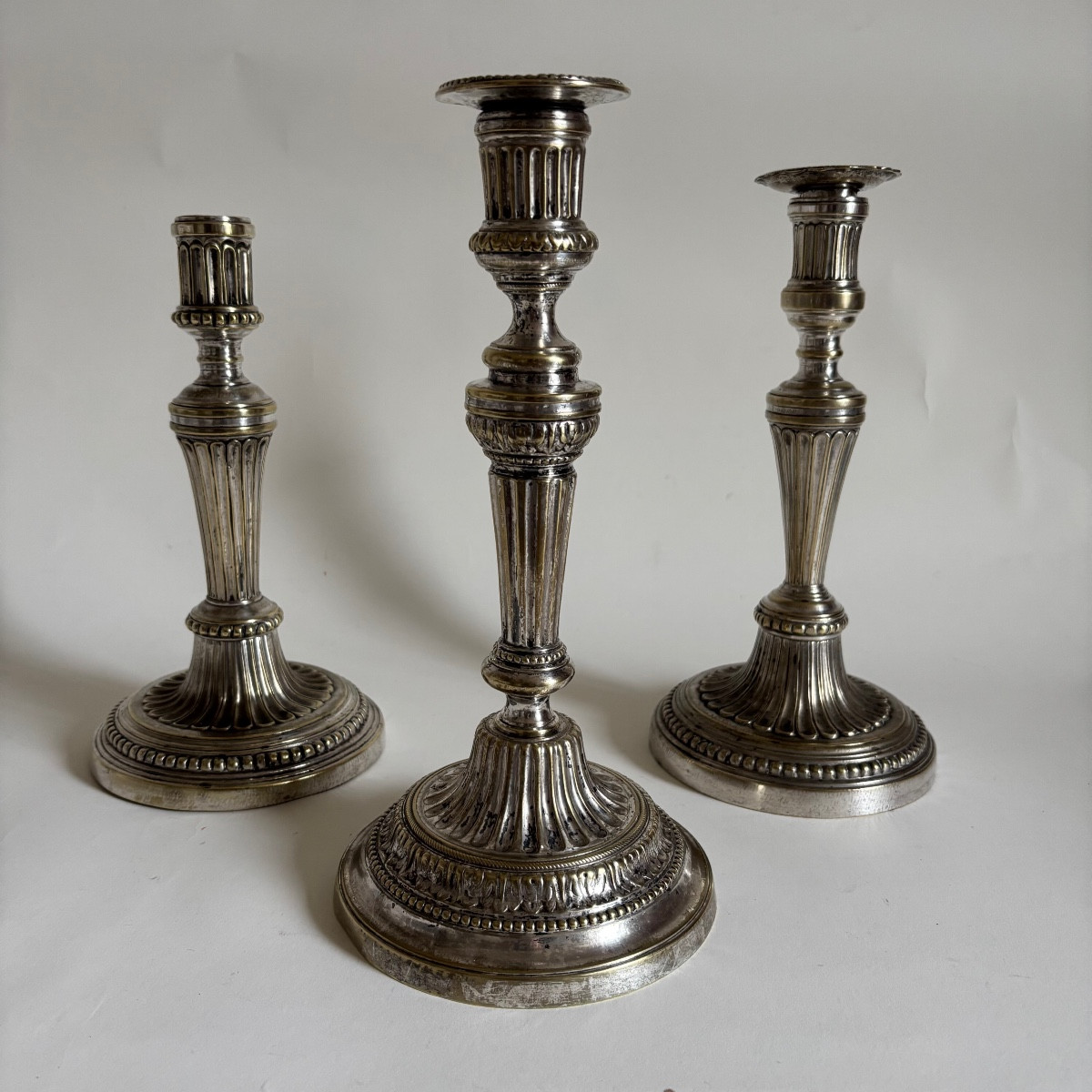 Three Louis XVI Period Silvered Bronze Candlesticks, 18th Century