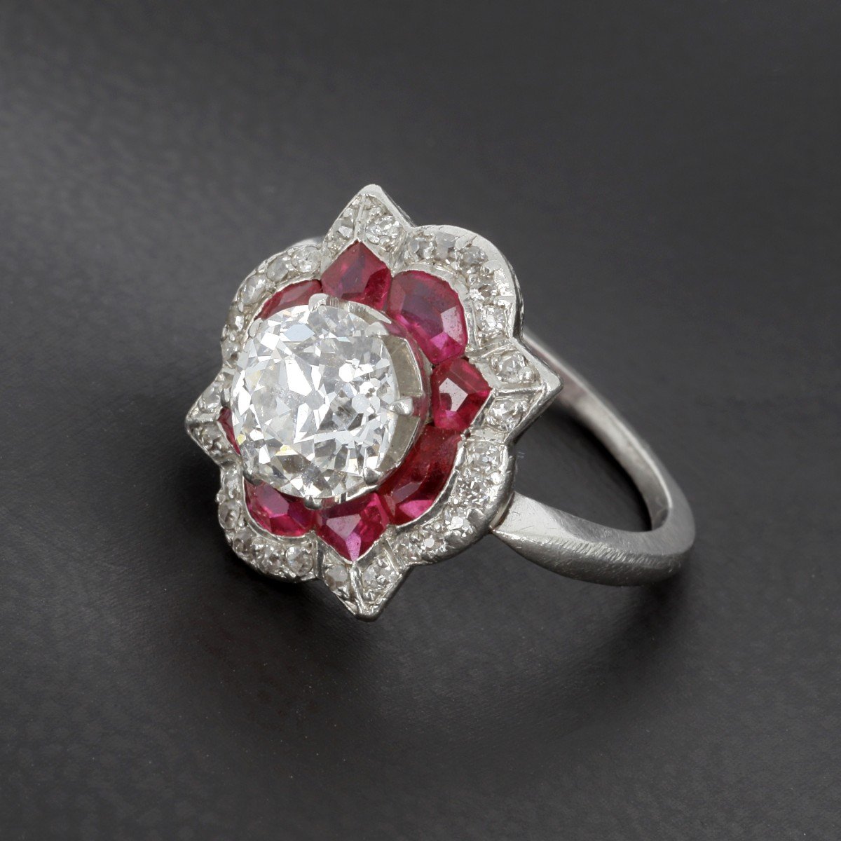 Art Deco Ring In Platinum Presenting A Diamond Surrounded By Verneuil Ruby