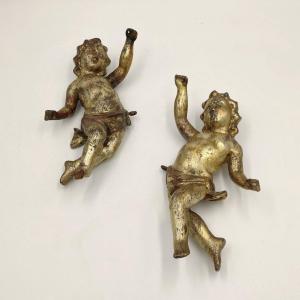 Pair Of Carved And Gilded Wooden Putti, 18th Century.
