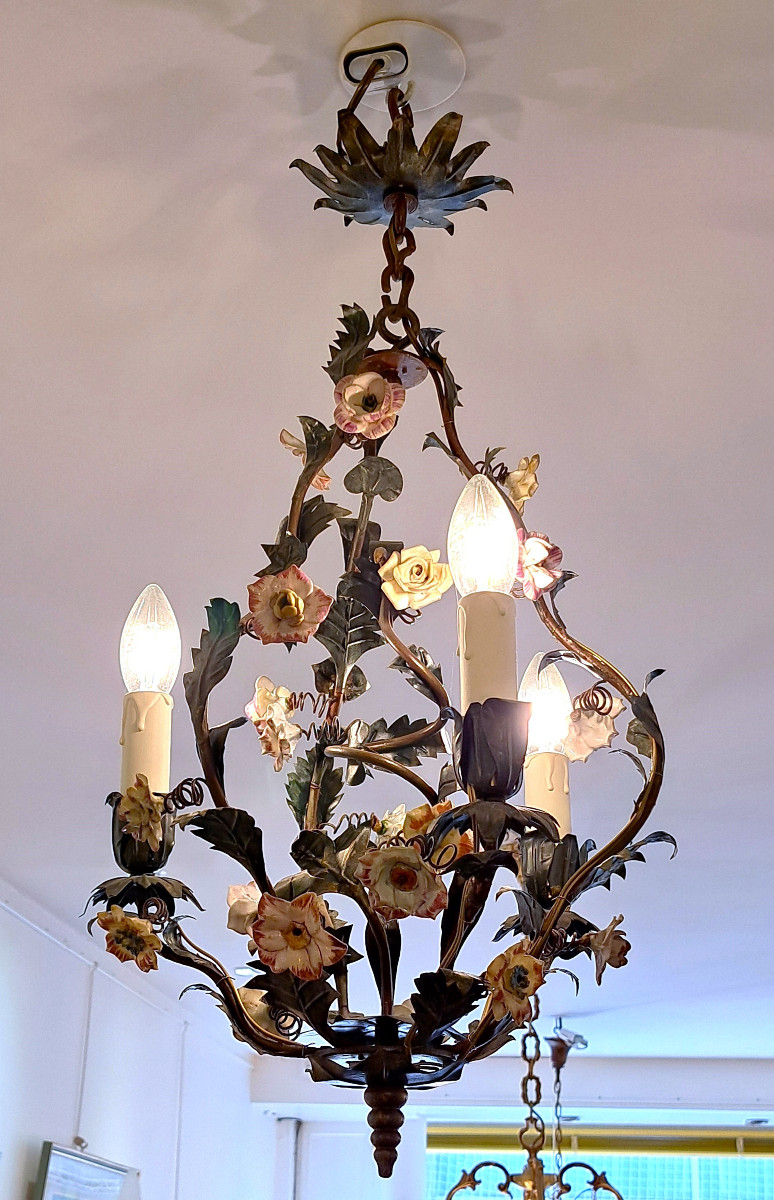Cage Chandelier Decorated With Branches And Flowers