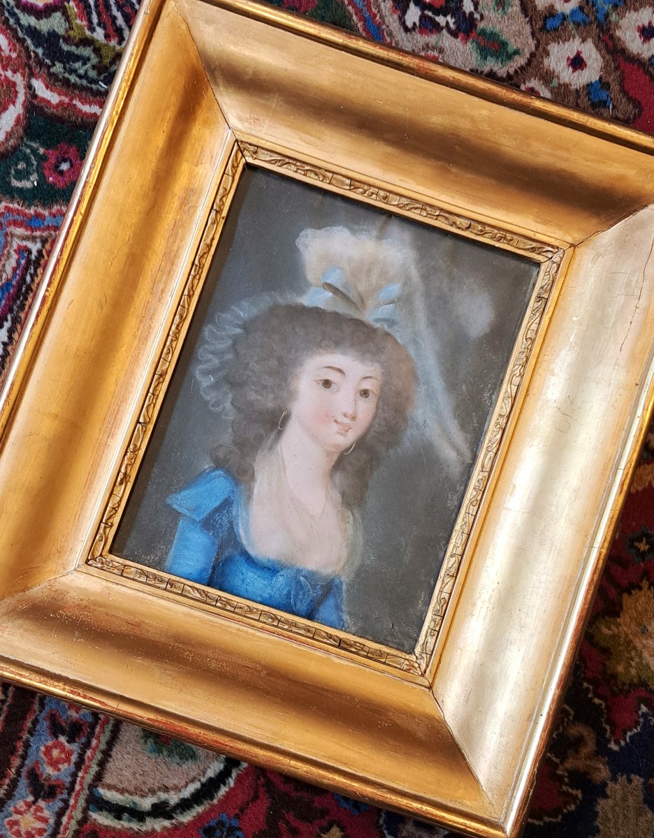 Portrait Of A Young Woman With A Blue Bow