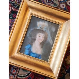 Portrait Of A Young Woman With A Blue Bow