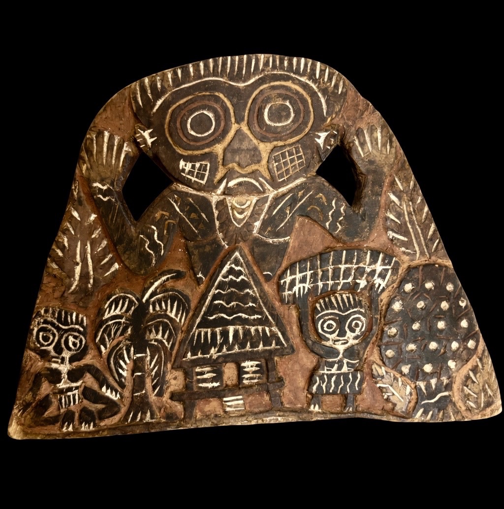 Carved Board With Spirit Figures