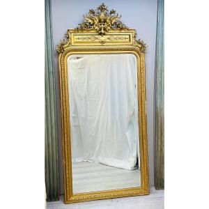 Grand et large miroir trumeau en bois doré  d’époque Napoléon III 