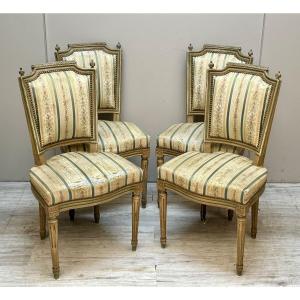 Suite de quatre chaises en bois laqué de style louis XVI 