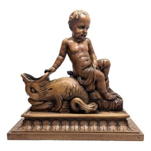 Wooden Sculpture Of A Baby Leaning Against An Animal 19th Century