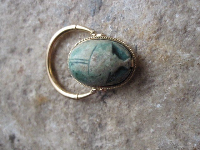Ring With Scarab With Tilting Hieroglyphic Inscription Mounted In Gold.