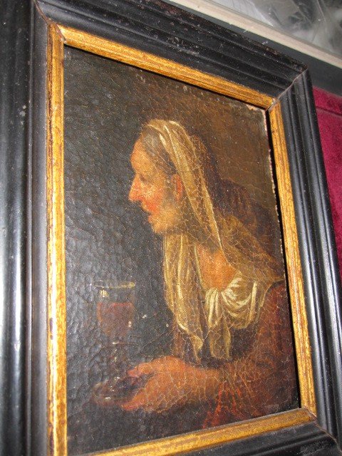 Old Woman With A Glass Of Wine. Small And Mysterious Canvas From The 17th Century.