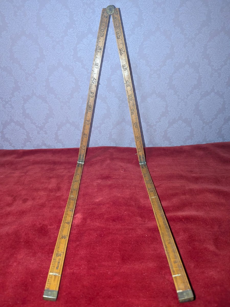 A 19th-century Spanish Measuring Rod, Marked In Feet And Centimeters.