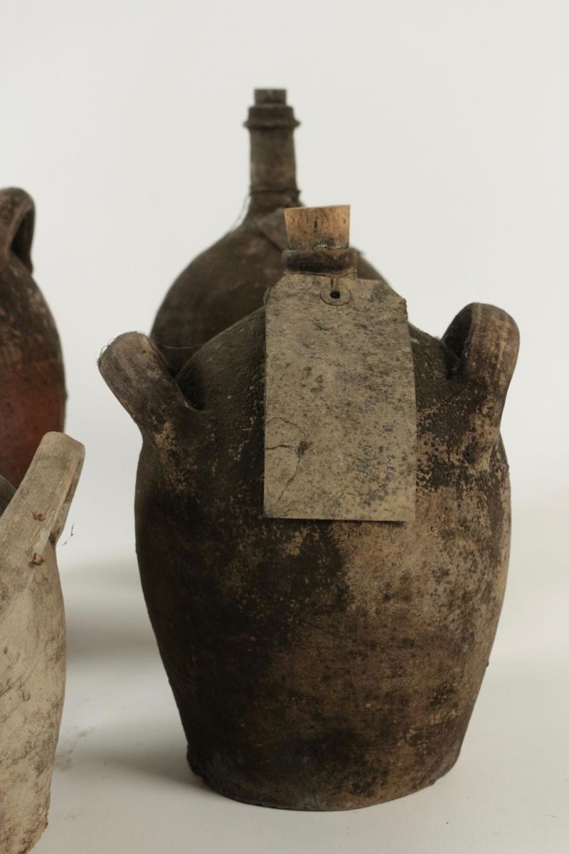 Collections Of Empty Ancient Bottles In Terra Cotta.-photo-3