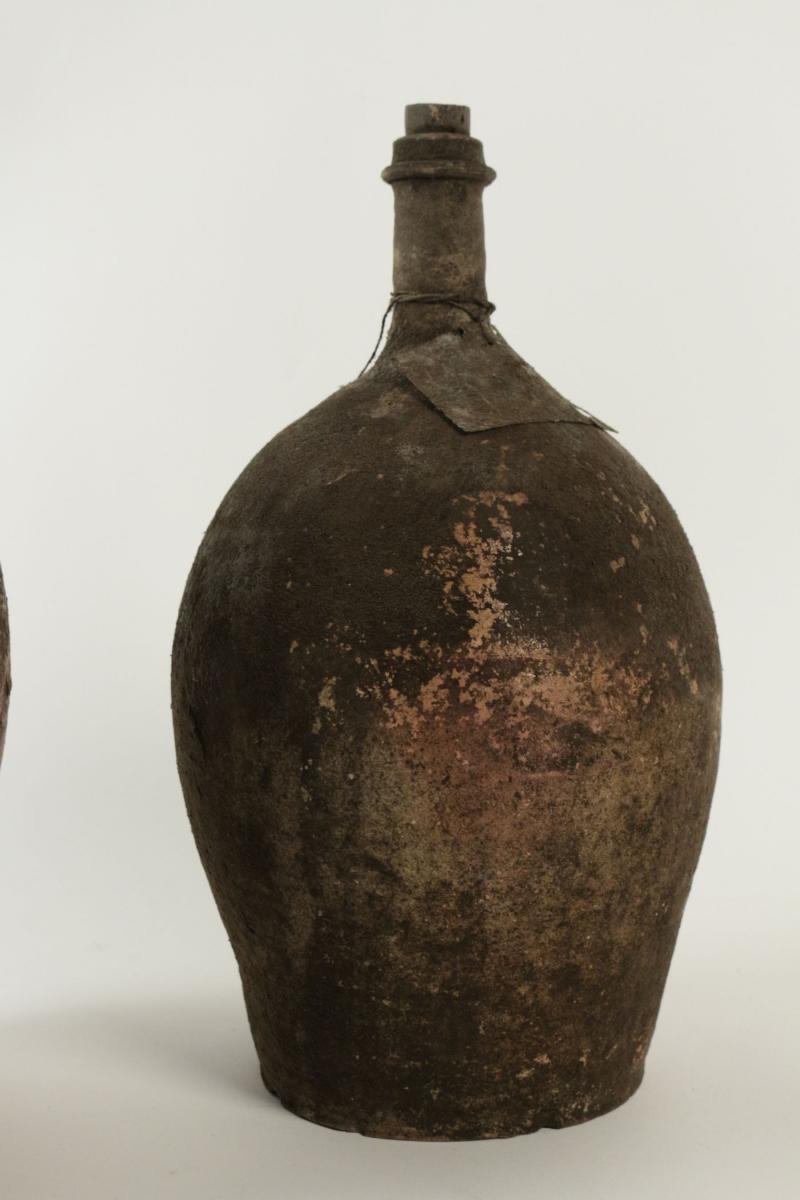 Collections Of Empty Ancient Bottles In Terra Cotta.-photo-1