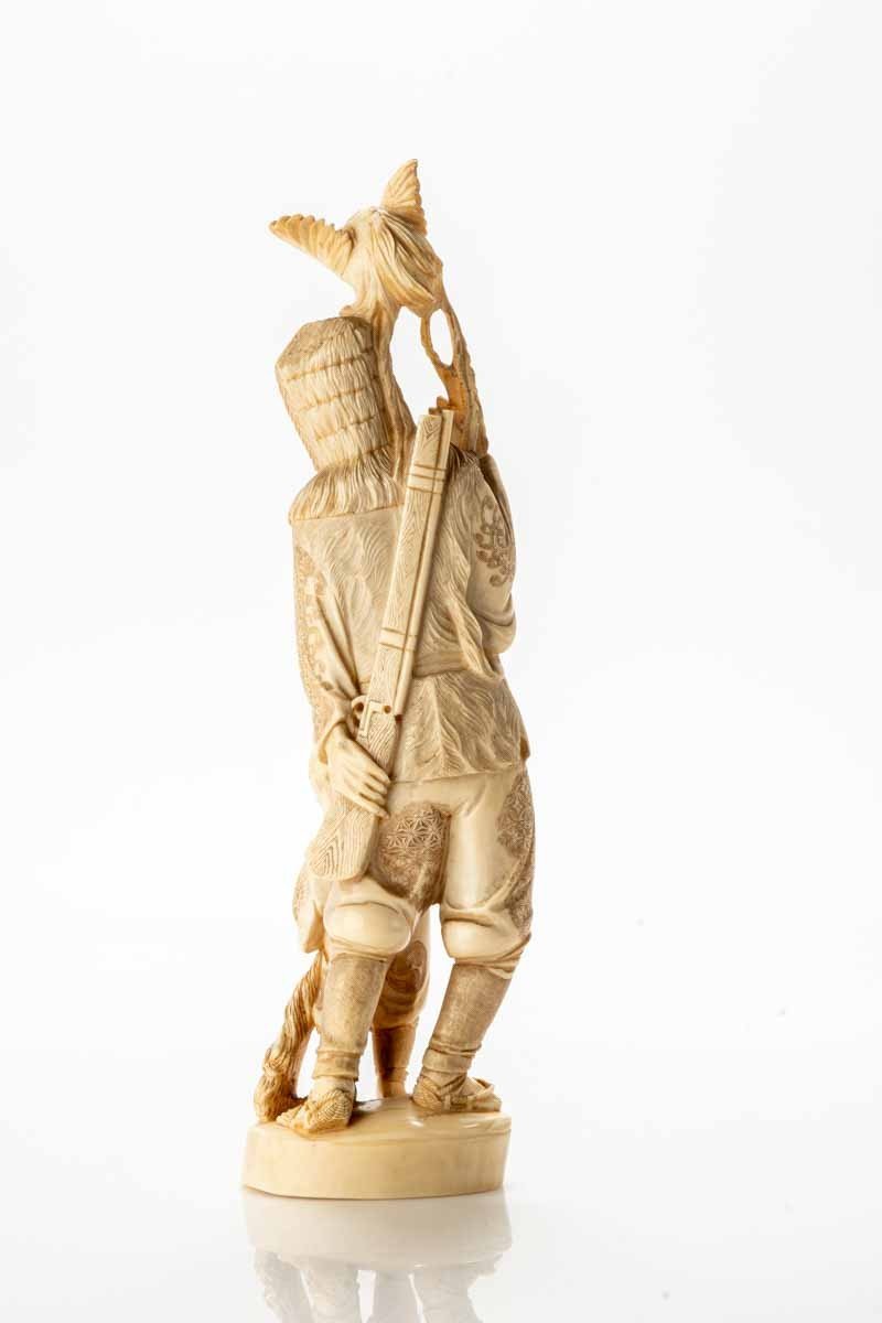 A Japanese Ivory Okimono Depicting A Hunter With An Onagadori Rooster-photo-3