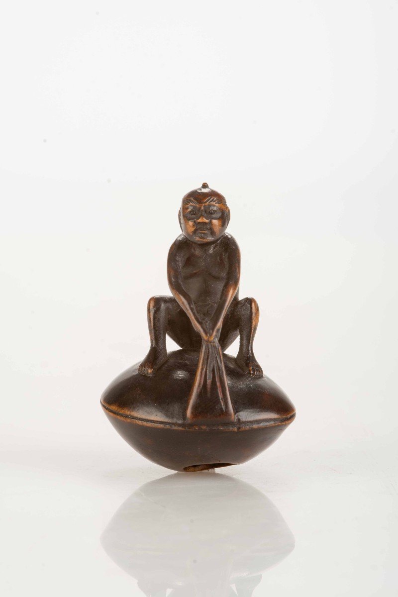 A Boxwood Netsuke Depicting A Character Sitting On A Giant Hamaguri-photo-2