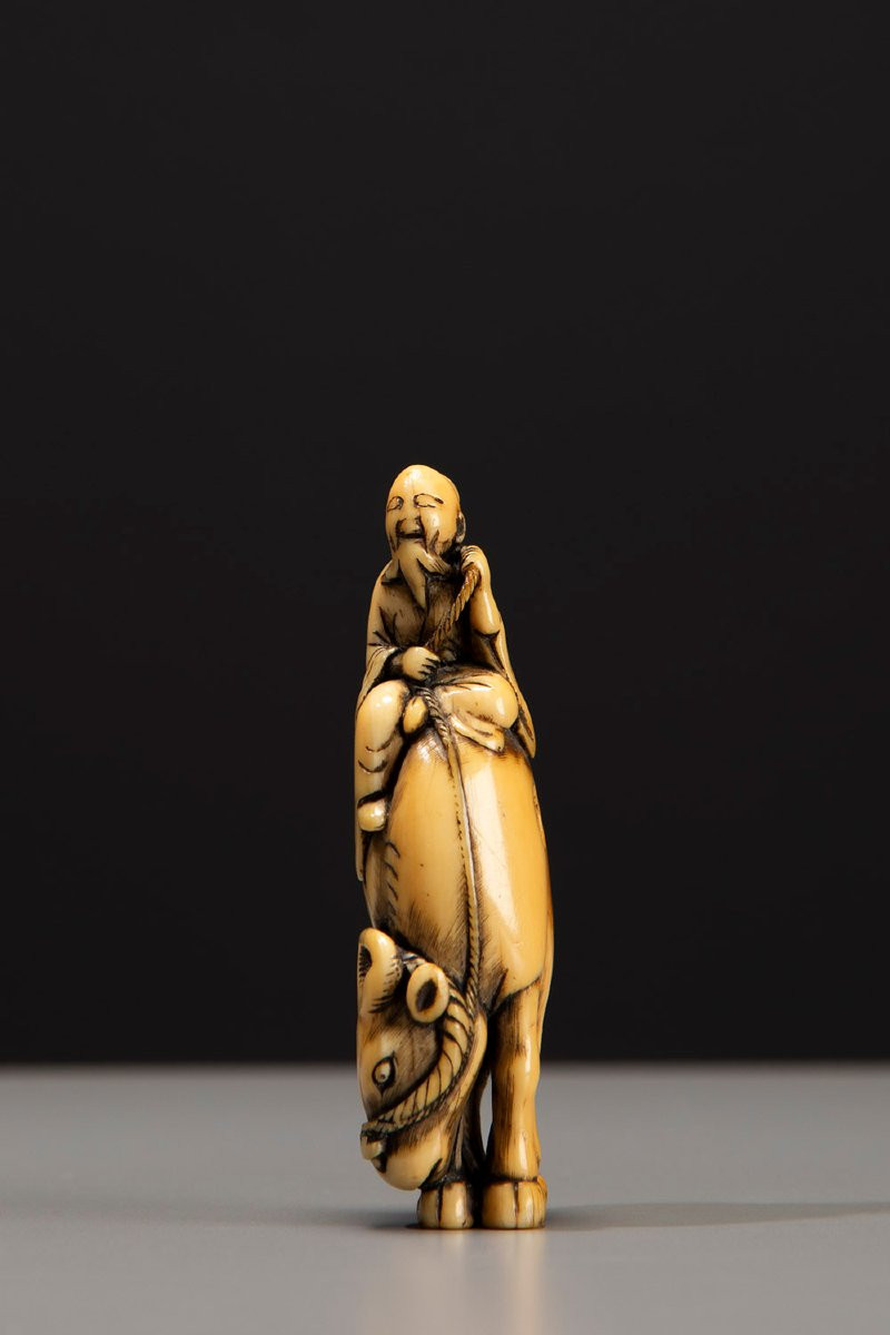 An Ivory Netsuke Depicting Roshi Seated On The Back Of A Buffalo-photo-2