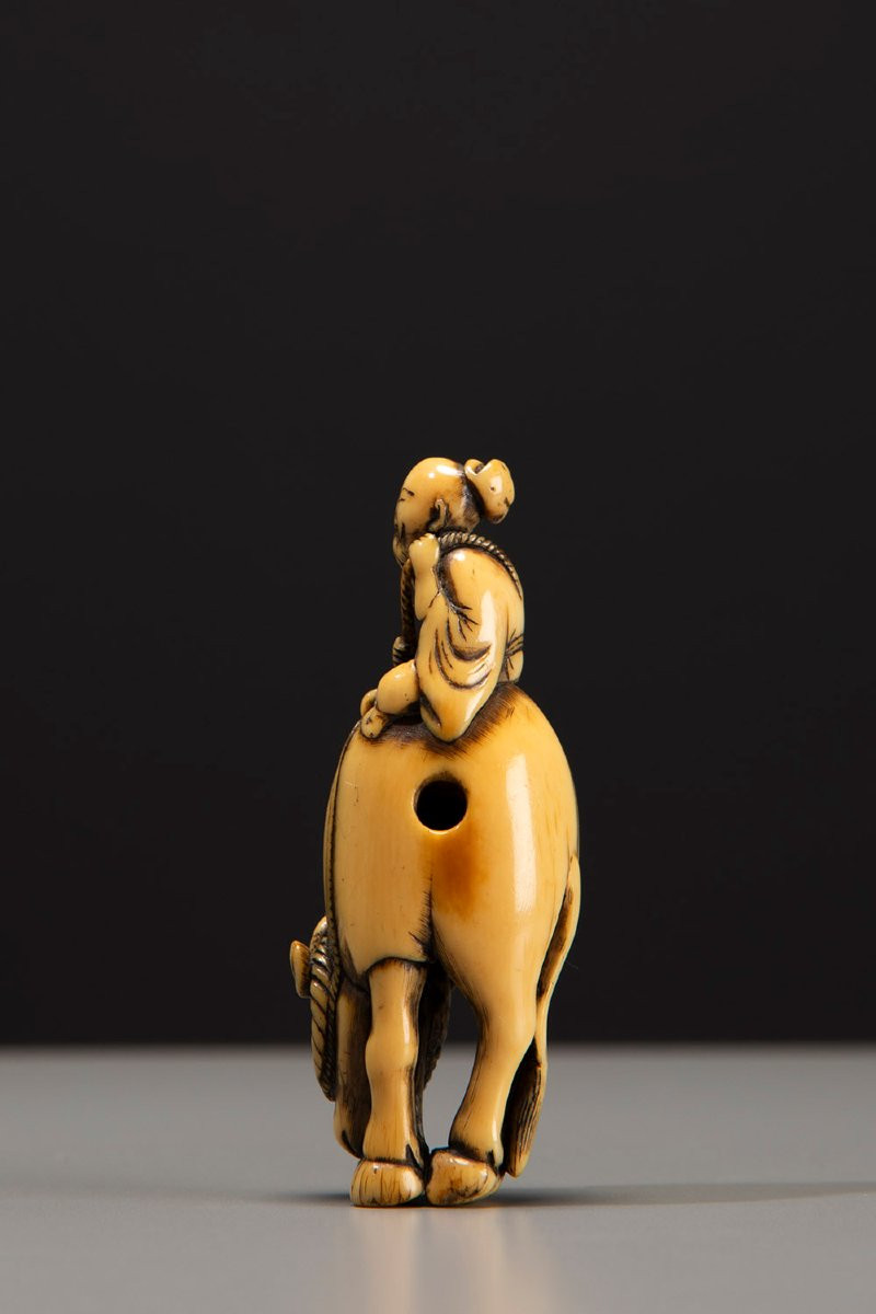 An Ivory Netsuke Depicting Roshi Seated On The Back Of A Buffalo-photo-3