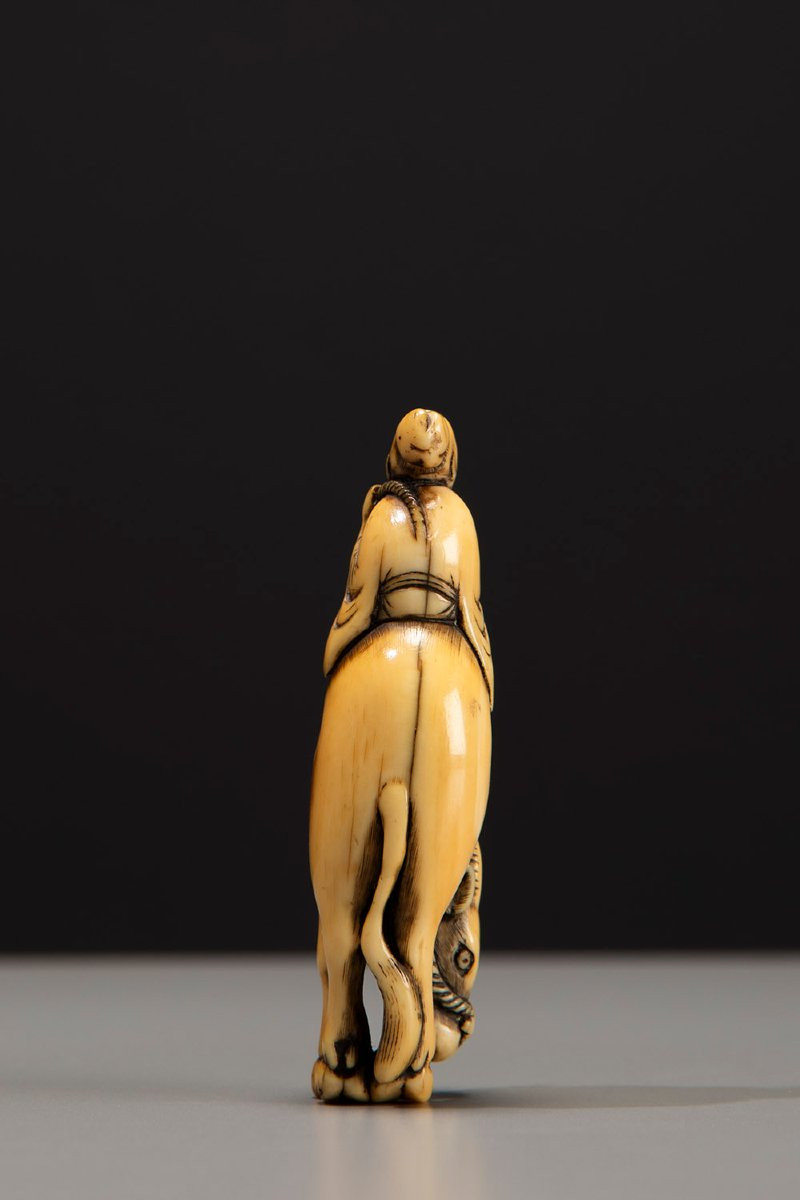 An Ivory Netsuke Depicting Roshi Seated On The Back Of A Buffalo-photo-4
