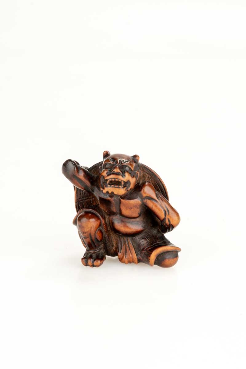A Boxwood Netsuke Depicting An Oni And The Setsubun Festival