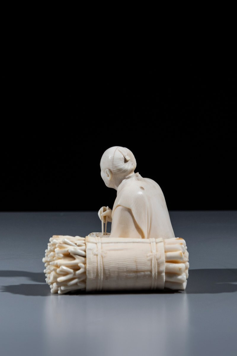An Ivory Okimono Depicting A Woodcutter-photo-2