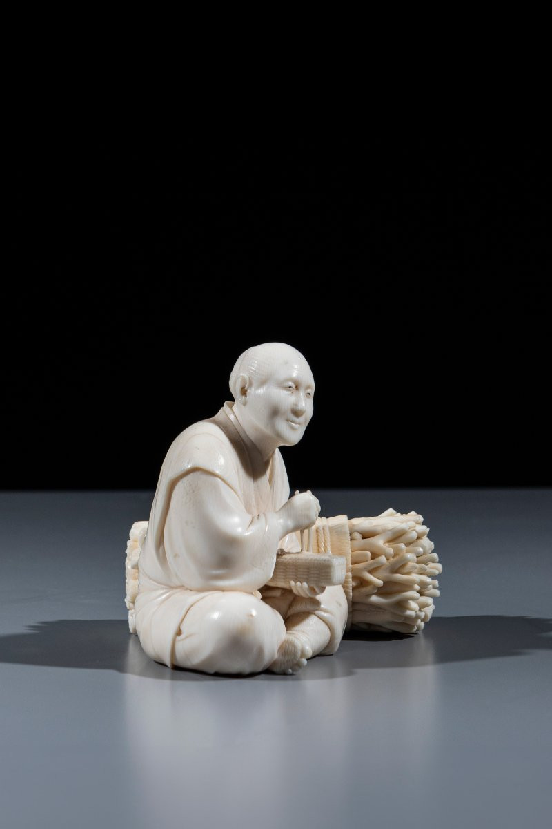 An Ivory Okimono Depicting A Woodcutter-photo-4