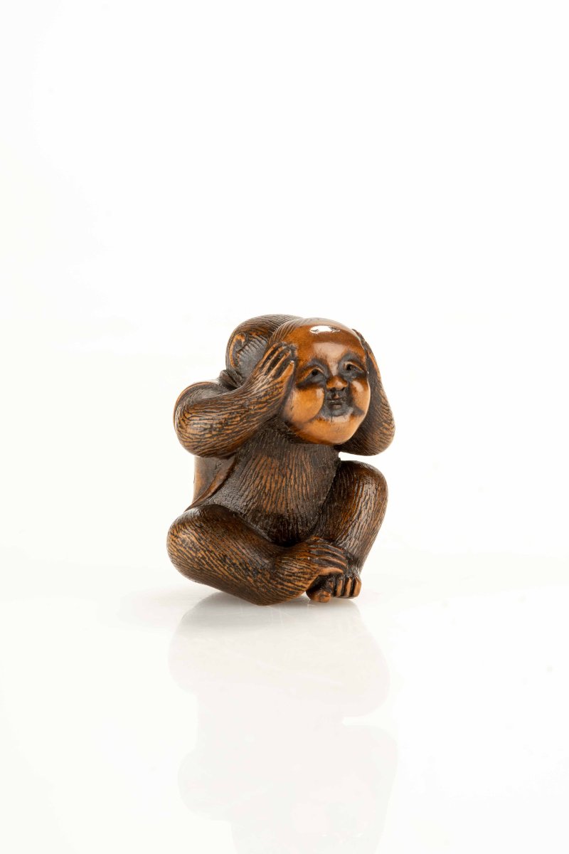 A Boxwood Netsuke Depicting A Monkey With An Okame Mask-photo-1