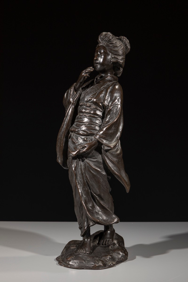 A Bronze Okimono Depicting A Walking Geisha, Signed Seiya Zō