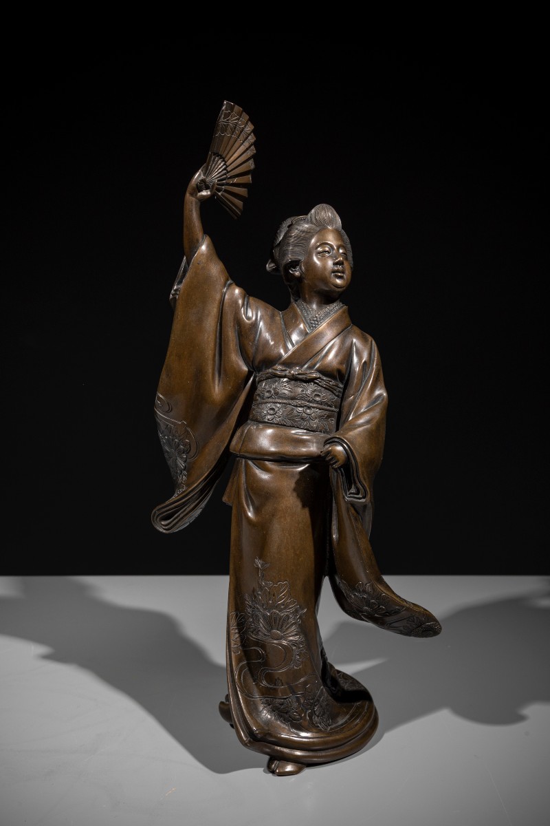 A Bronze Okimono Depicting A Dancer With A Fan
