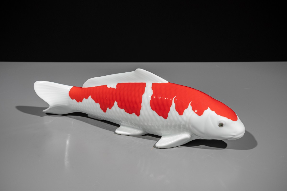 A Porcelain Okimono Of A Red And White Koi Carp