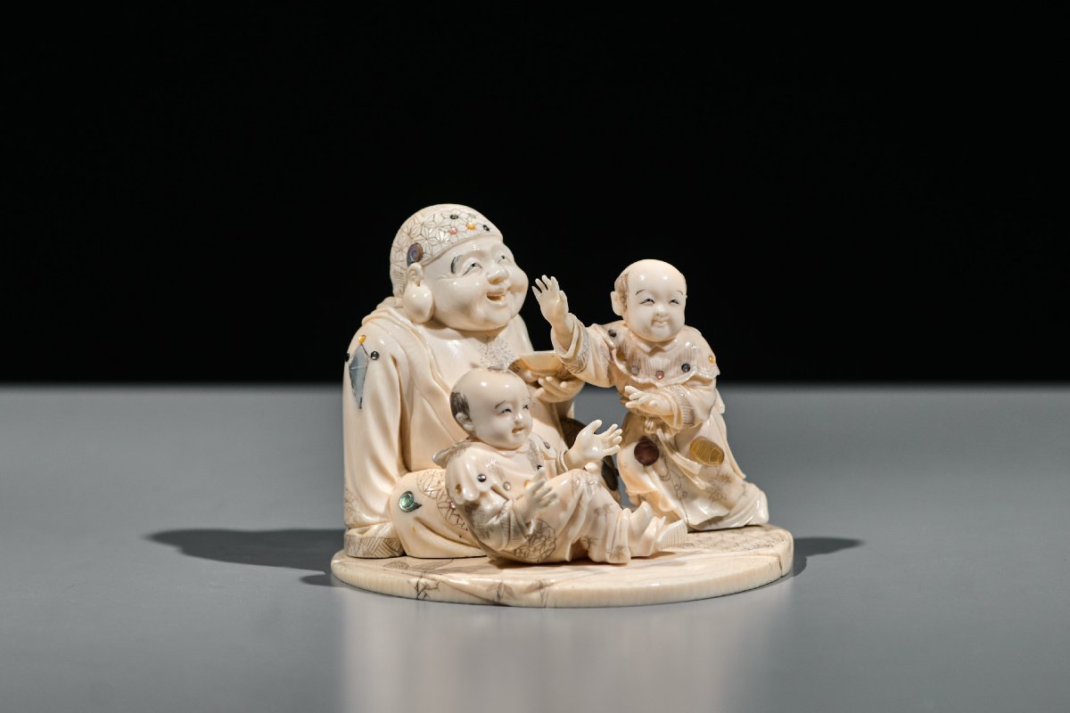 An Ivory And Shibayama Okimono Of Hotei With Karako Signed Gyokuzan