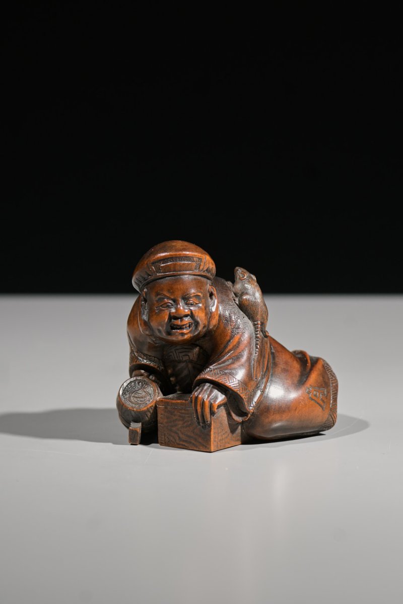 A Boxwood Okimono Of Daikokuten With A Mouse
