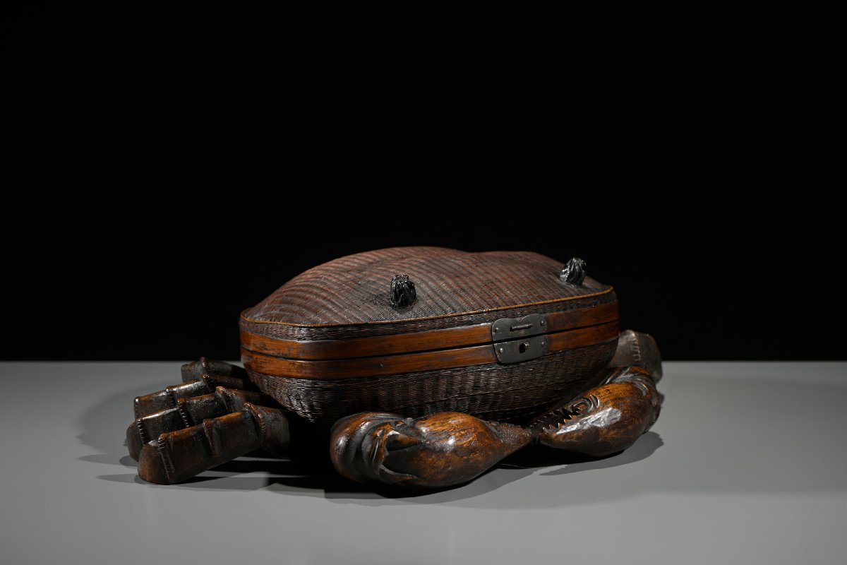 A Woven Bamboo And Wood Box In The Shape Of A Crab