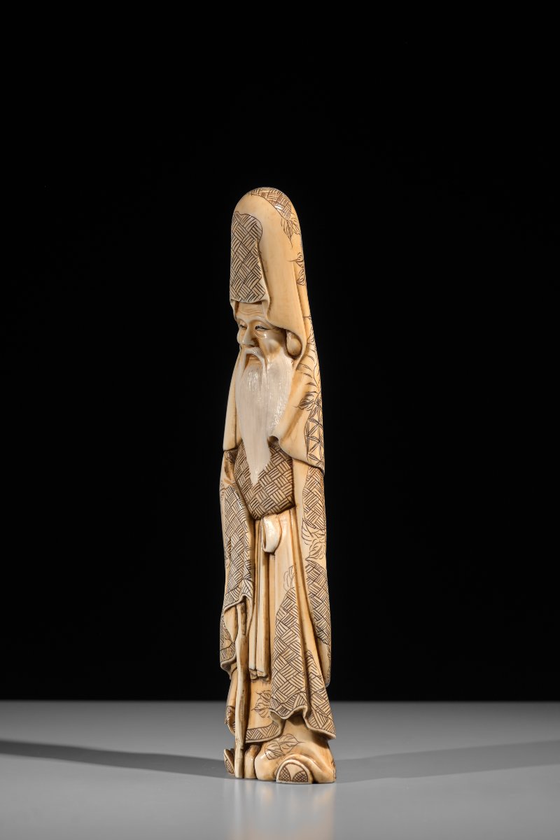 A Marine Ivory Okimono Depicting Jurojin, Signed Gyokuzan