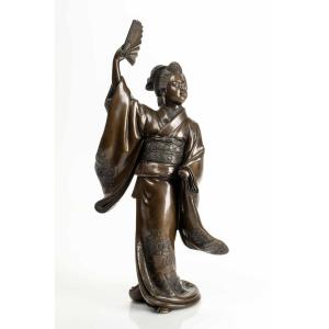 A Japanese Bronze Sculpture Depicting A Dancer With Fan