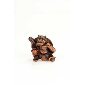 Netsuke en bois de buis représentant un Oni et la fête de Setsubun
