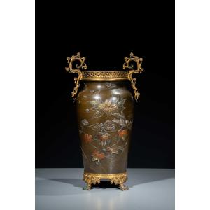 A Bronze Vase With Floral Decorations And Sparrows In Flight